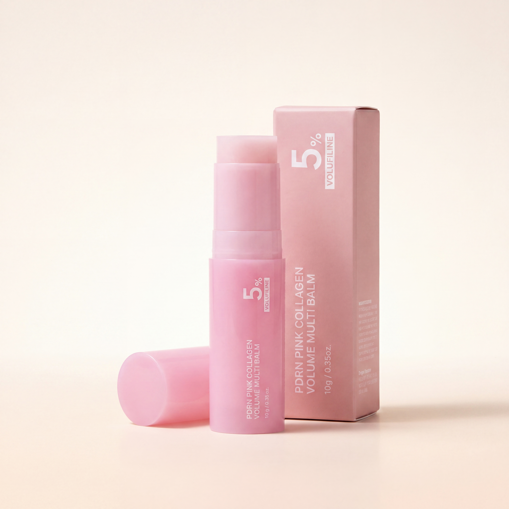 Aurelly Collagen Glow Multi-Balm — uncapped pink twist-up stick with cap and retail box on warm ivory background